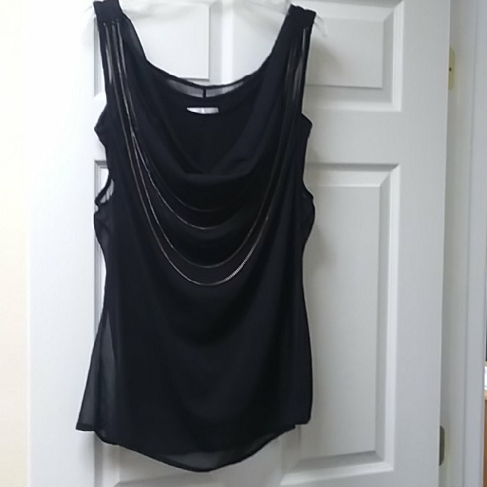 Linda Segal black top with jewelry